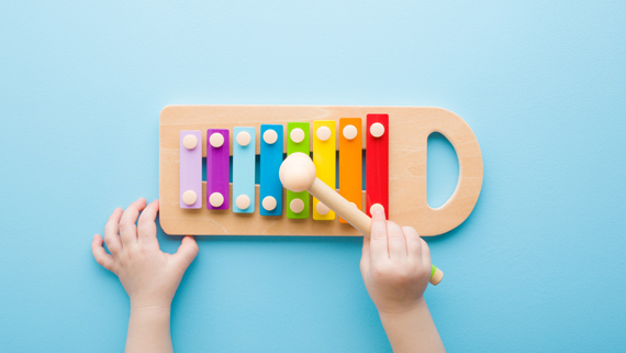 A child plays a xylophone.